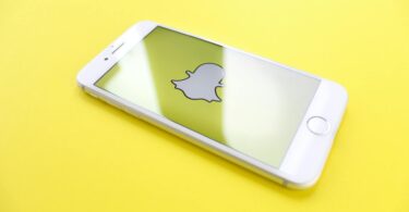 iphone on yellow surface