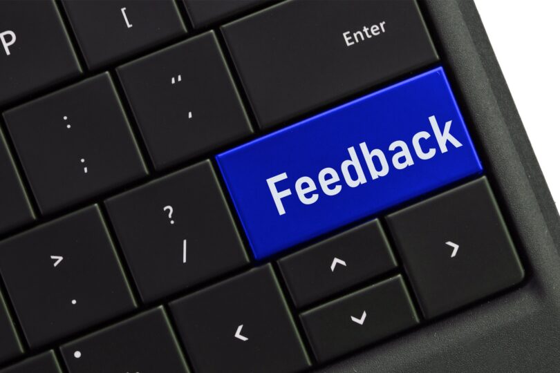 Computer keyboard with a FEEDBACK button. Concept - users ratings pros cons thoughts input