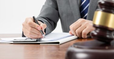 Lawyer working with lawsuit documents - law and justice concept