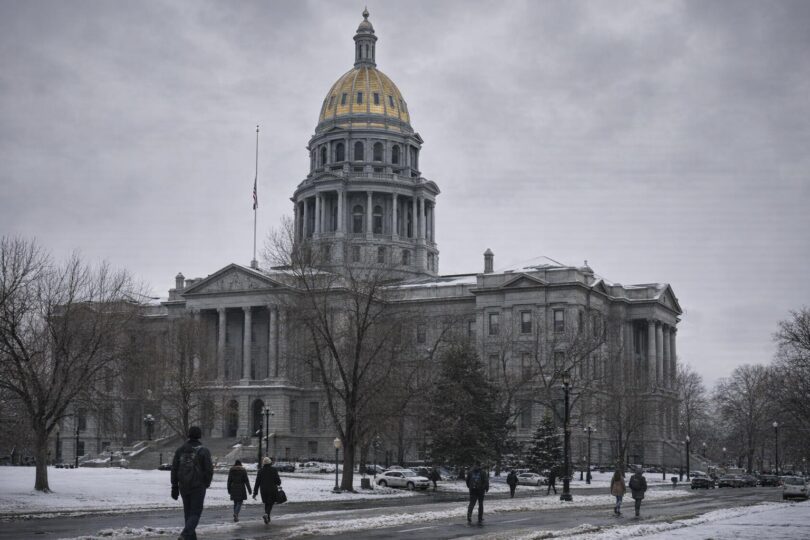 Colorado State Capitol in Denver with people walking outside on a winter day