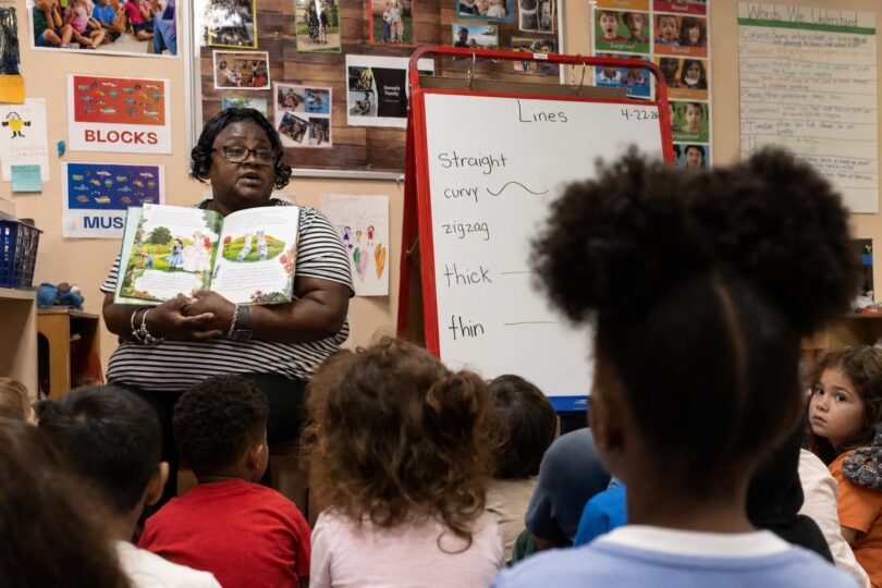 Colorado preschool classroom with young children and a teacher during group learning