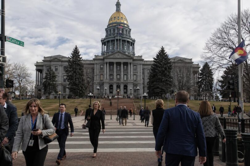 Colorado State Capitol in Denver with people outside during a legislative day