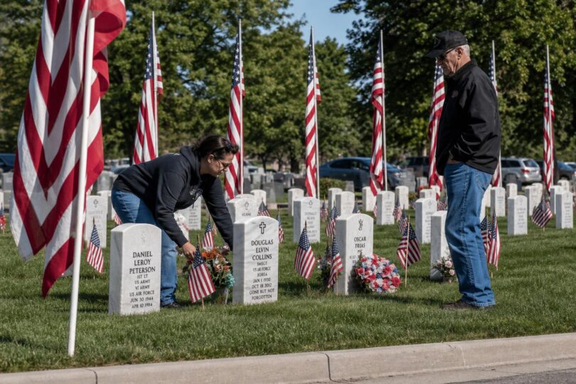 American flags line cemetery grounds for a Greeley Memorial Day ceremony