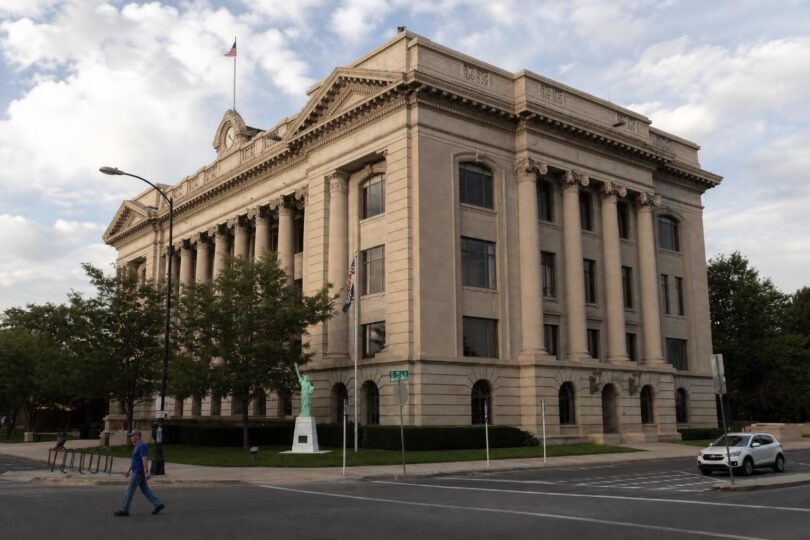 Weld County public meeting room with officials discussing Justice Center voters issue
